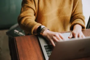 person typing on laptop