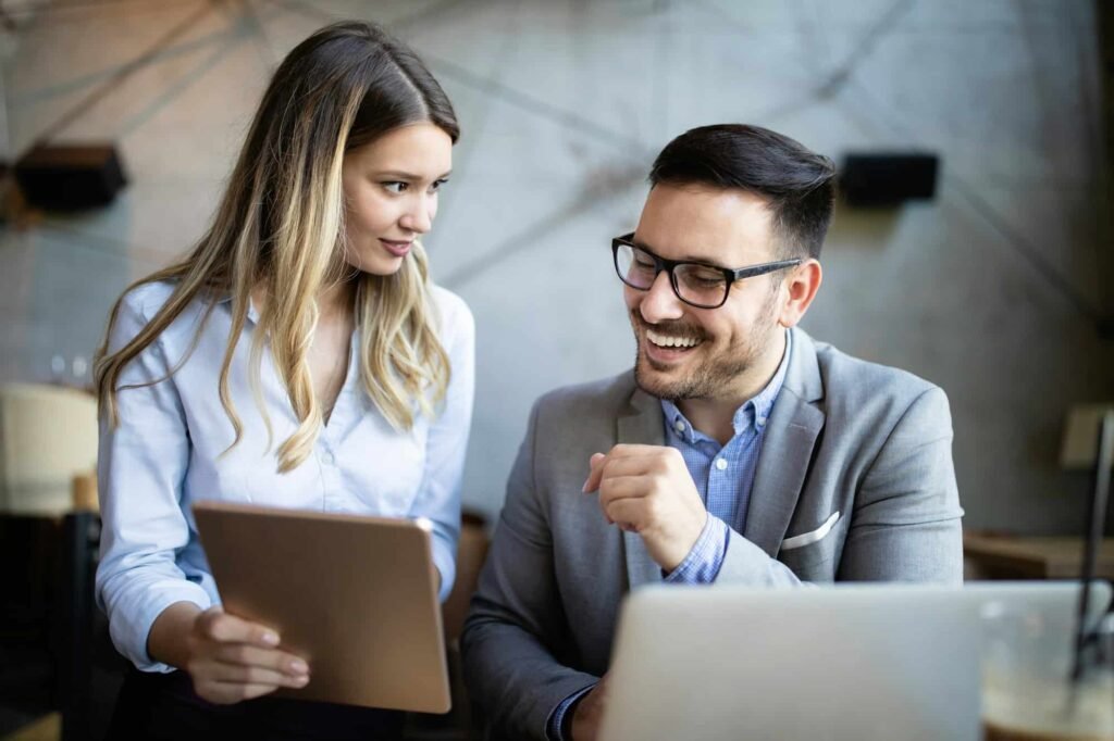 Free Website Audit woman and man looking at tablet together