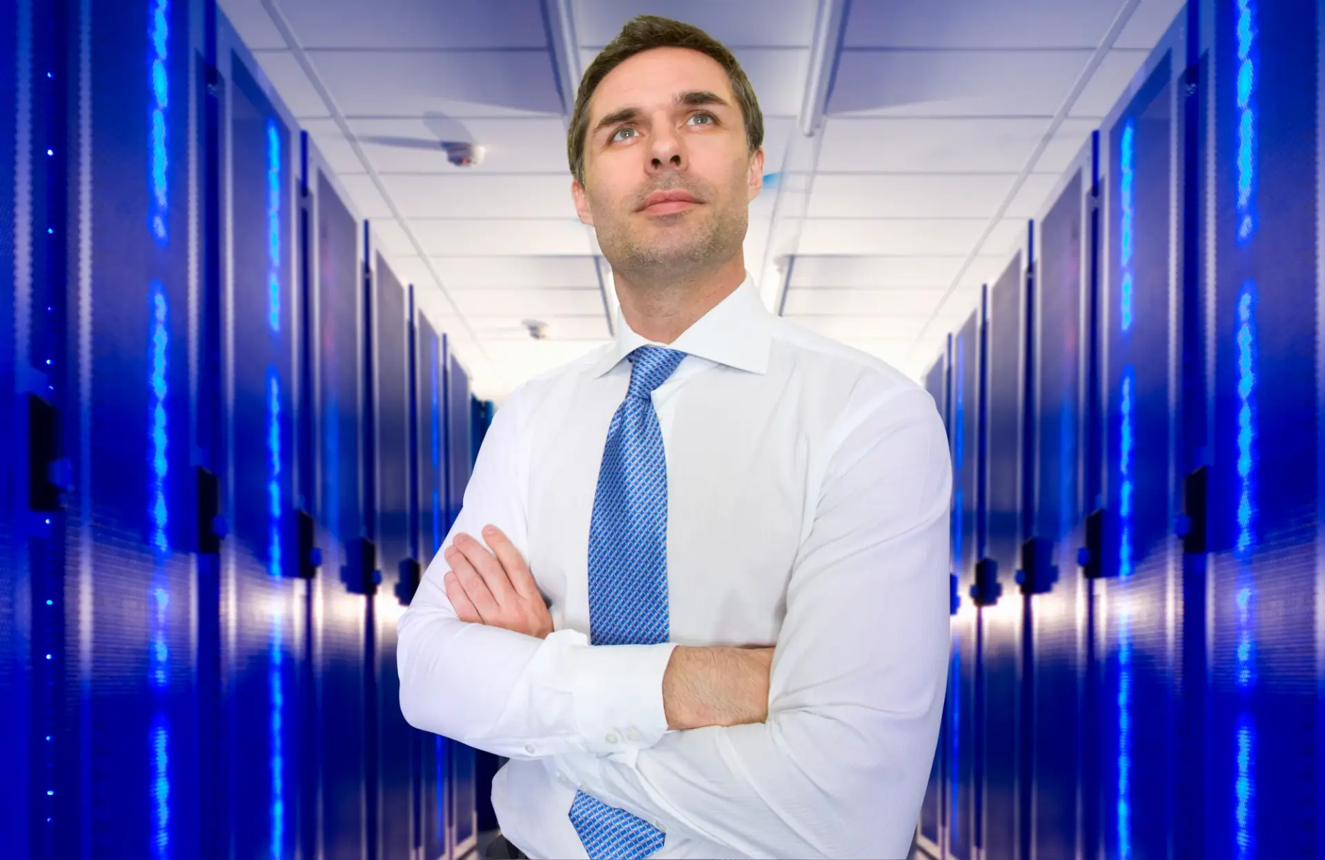 man standing in server room contemplating the best website hosting for small business